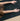 woman in childs pose on Rituil™ ash or black cork yoga mat #color_ash