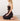 woman meditating on earth color restorative yoga block and natural cork yoga mat #color_sand