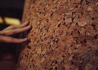 hand on cork material made for yoga mats