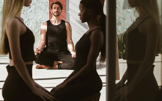 Woman and Man meditating on sustainable cork yoga mat