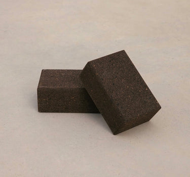 Two sustainable natural brown cork yoga blocks from Rituil, ideal for yoga and pilates practice and stretching exercises. #color_earth