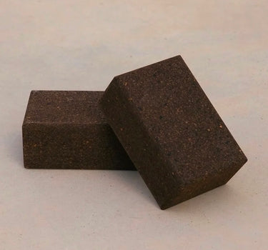 Two sustainable natural brown cork yoga blocks from Rituil, ideal for yoga and pilates practice and stretching exercises. #color_earth