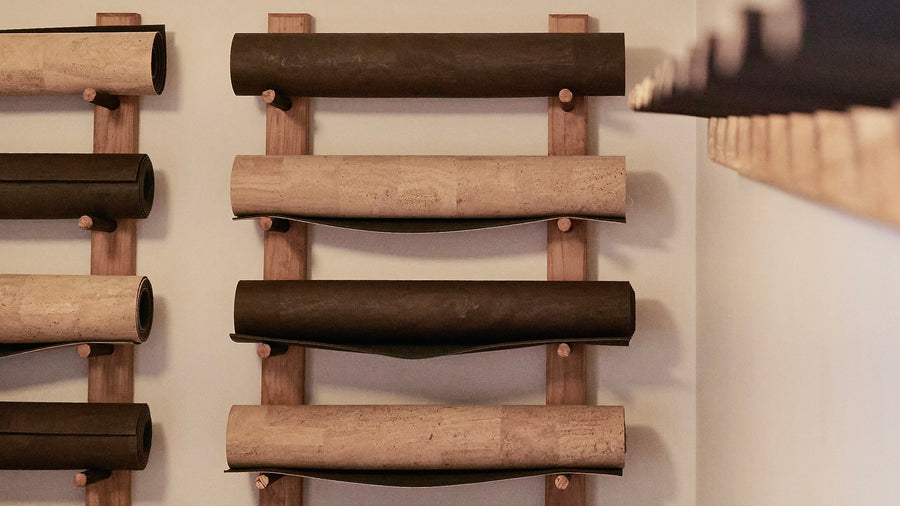 RITUIL CORK YOGA MATS IN YOGA STUDIO ON WALL RACK
