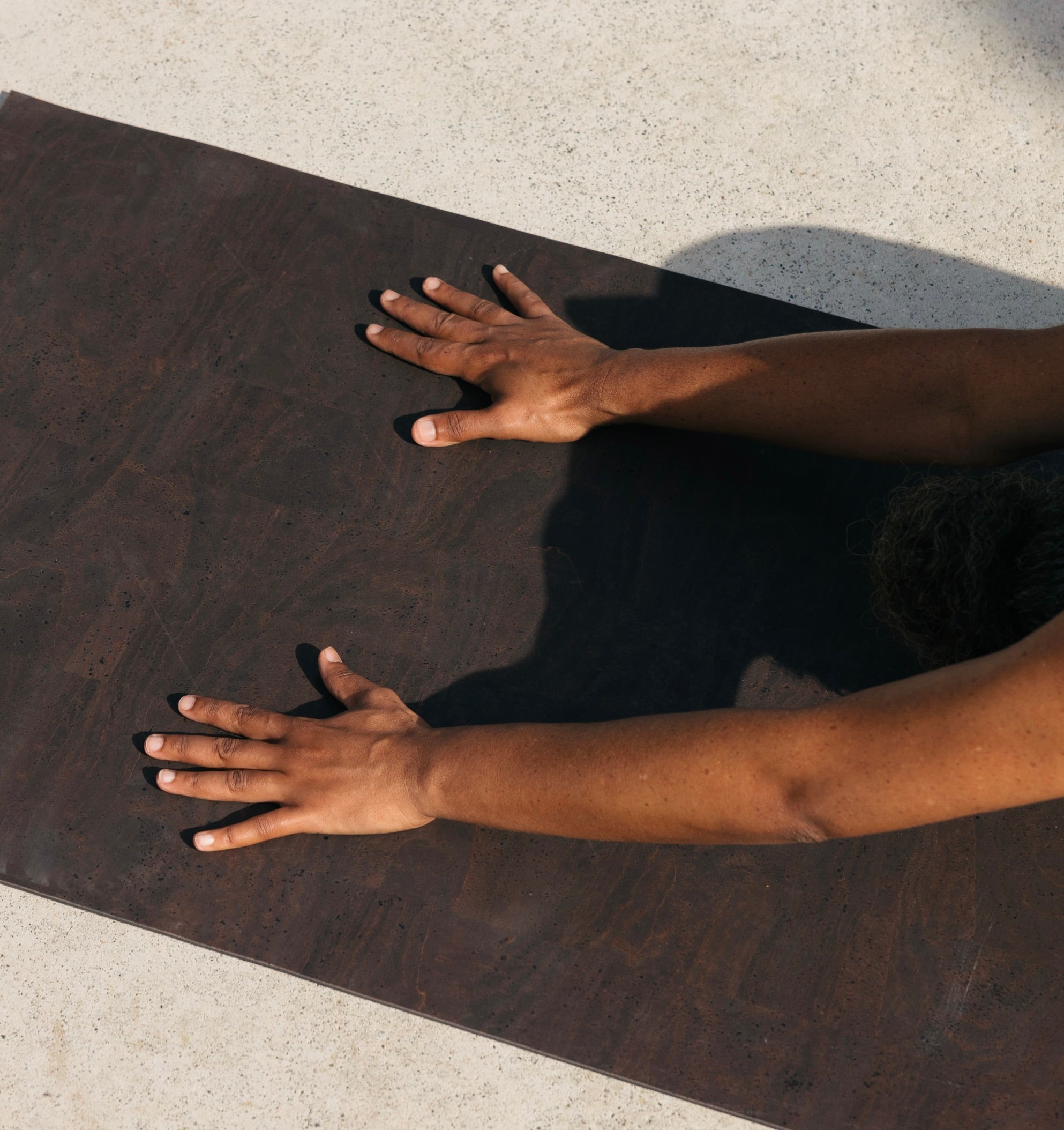 womanman practicing hot yoga on rituil non-slip, non-toxic brown cork leather yoga mat