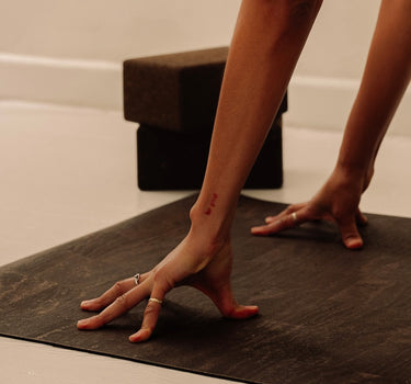 woman practicing yoga on brown rituil non-slip non-toxic sustainable cork leather yoga mat  #color_earth