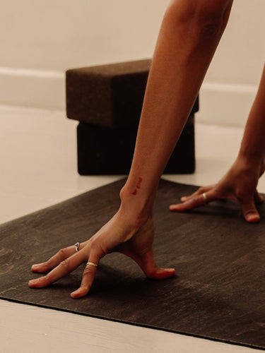woman practicing yoga on brown rituil non-slip non-toxic sustainable cork leather yoga mat  #color_earth