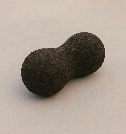 cork massage peanut on concrete surface