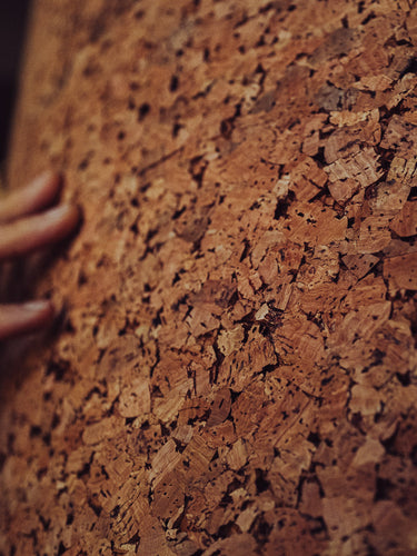 Man touching cork