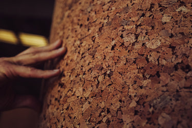 Man touching cork