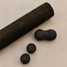 Rituil sustainable Portuguese cork massge roller, peanut and balls for yoga, Pilates core workouts, and deep tissue muscle recovery shown on concrete floor