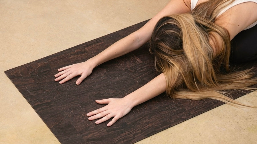 Cork yoga mat non-slip grip brown Rituil with woman in childs pose