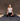 Woman practicing natural non slip yoga on a cotton yoga rug against a textured cork wall. #color_ash