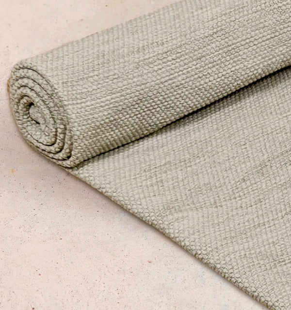 Close up image of rolled Rituil yoga recycled cotton rug in bone color #color_bone