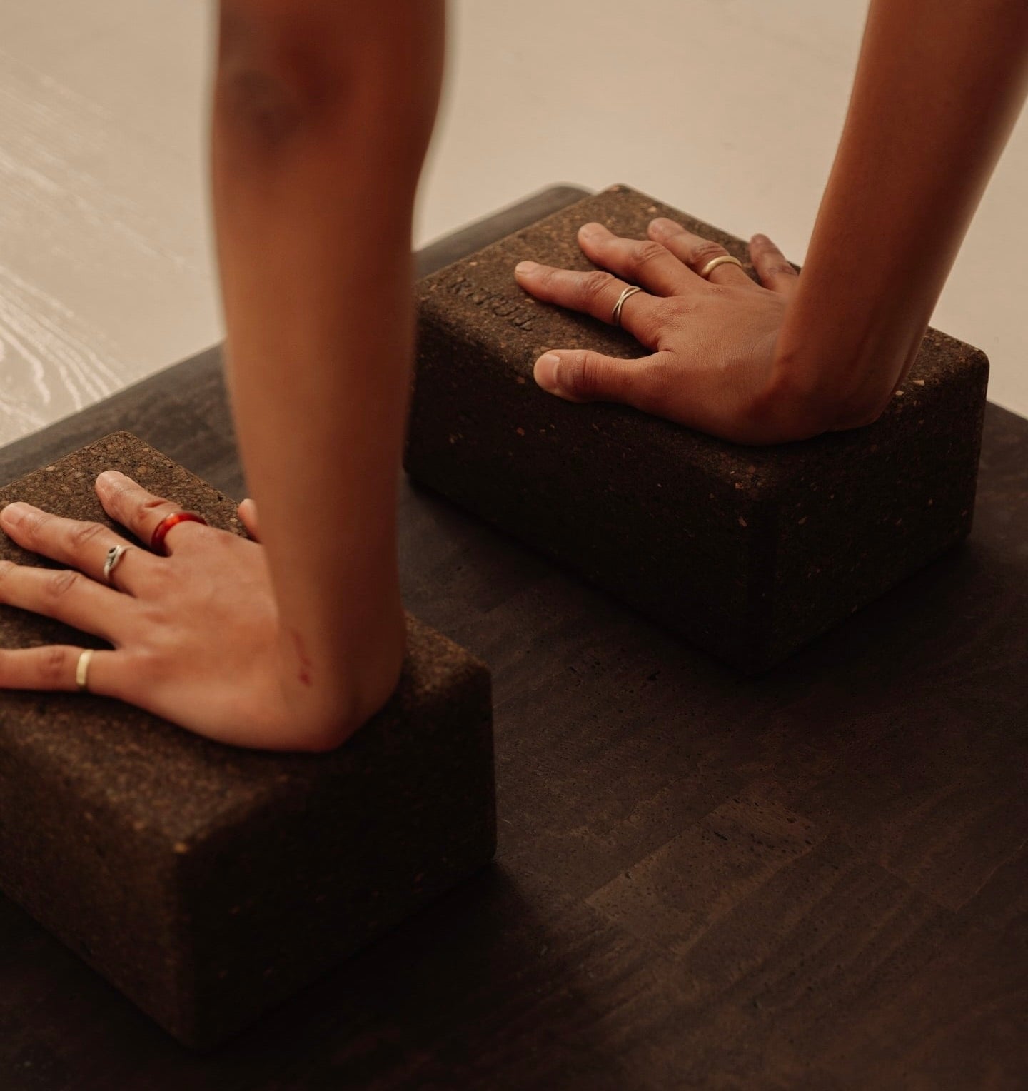 close up of non toxic Rituil cork yoga block on cork leather yoga mat brown #color_earth