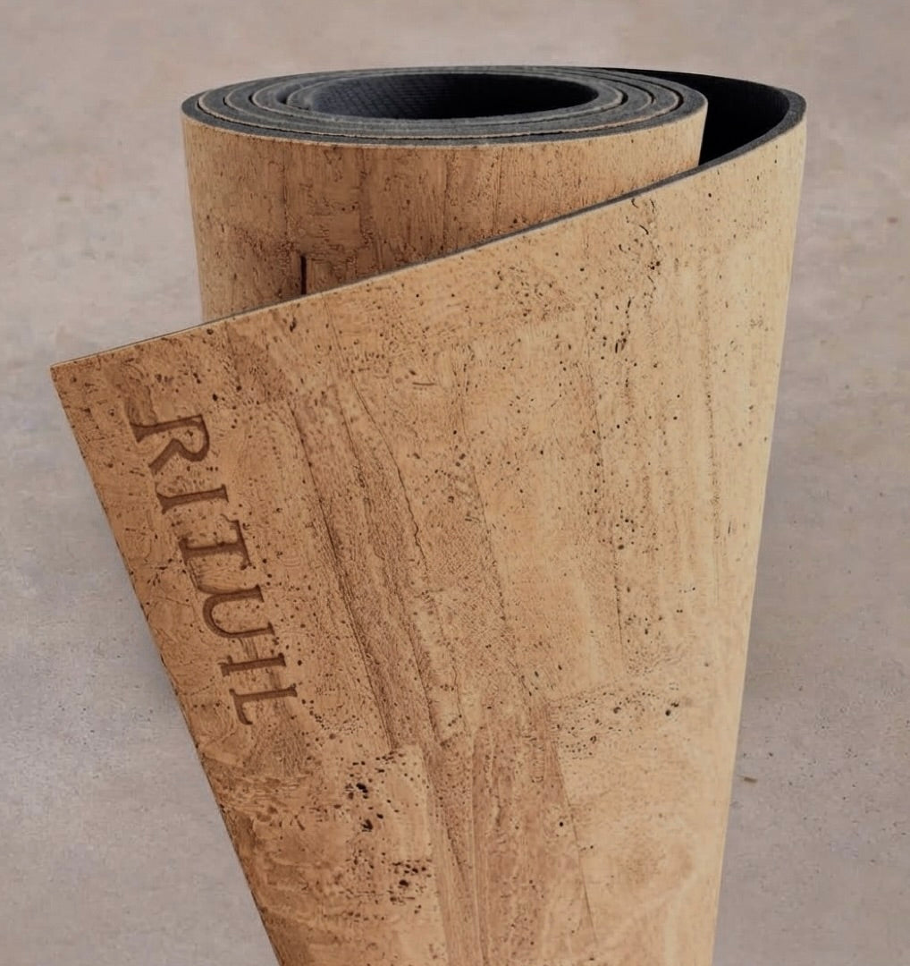 Extra long 6mm thick Rituil cork leather studio mat rolled in a natural warm cork shade, highlighting its antimicrobial and non-slip surface.
