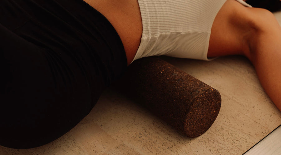 ustainable Portuguese cork massge roller for deep tissue muscle recovery shown on top of cork yoga mat