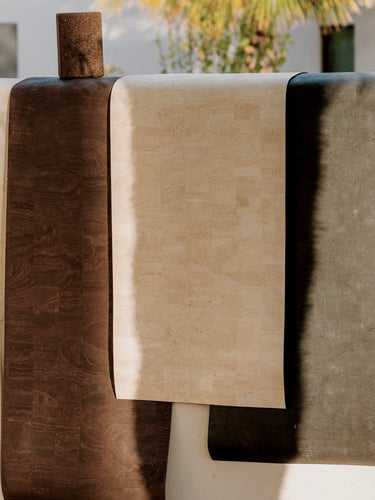 Three Rituil cork mats hanging on the wall #color_earth