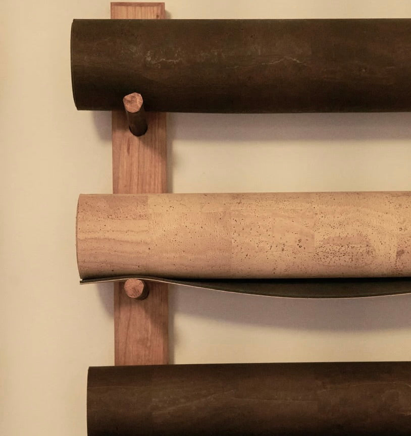 rituil cork studio mats rolled up on wall