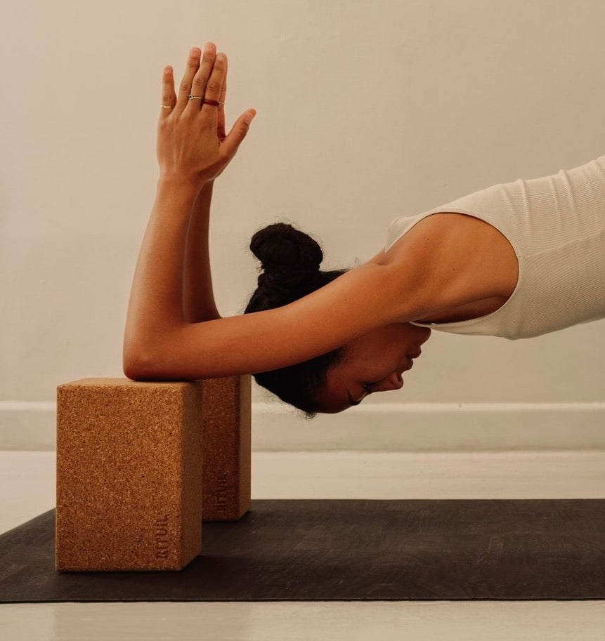 RItuil cork yoga blocks set of two on earth cork yoga mat with woman practicing yoga #color_sand