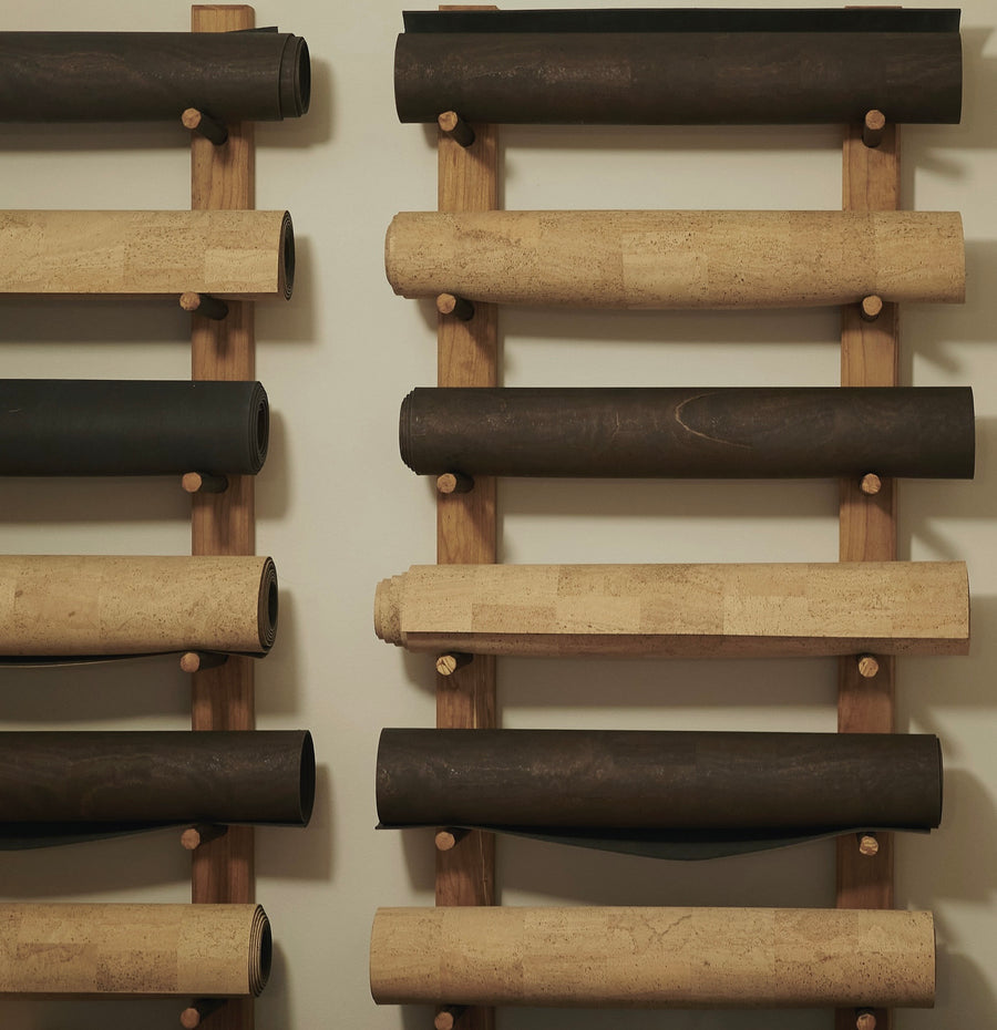 Rituil cork yoga mats rolled on wall