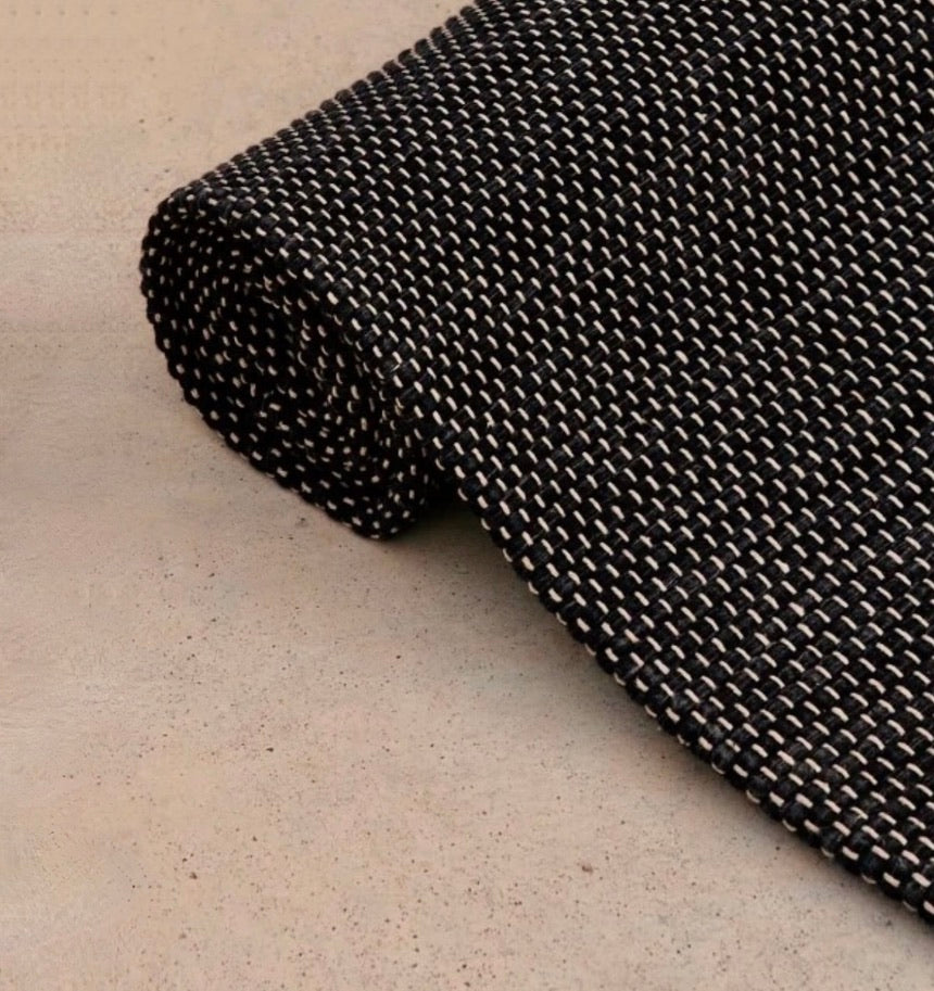 Rituil travel yoga rug in ash color, lightweight and portable, designed for yoga practice on the go.