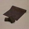 Rituil non slip and non toxic cork yoga mat and blocks set in brown color set on concrete floor