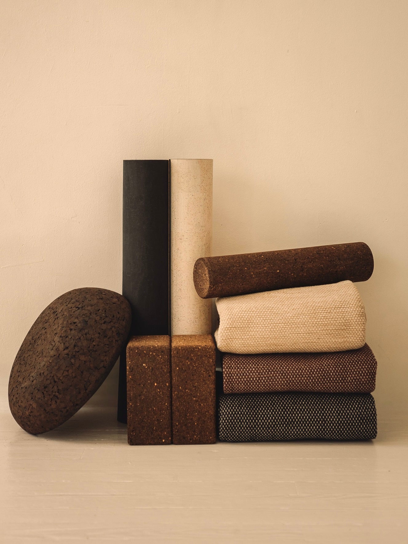 Rituil luxury cork leather yoga mats, blocks, rugs and meditation essentials on white floor