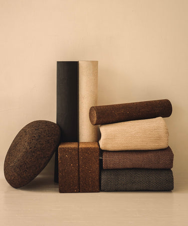 Rituil luxury cork leather yoga mats, blocks, rugs and meditation essentials on white floor
