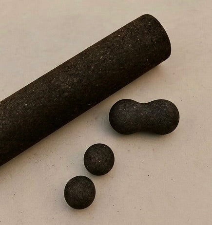 Rituil natural cork peanut roller paired with massage spheres and the main cork fitness roller.