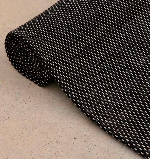 Rituil travel yoga rug in ash color, lightweight and portable, designed for yoga practice on the go.