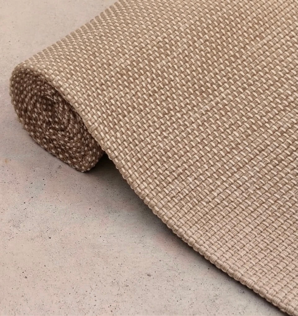 Rituil travel yoga rug in cream color, lightweight and portable, designed for yoga practice on the go.