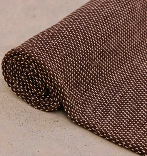  Rituil travel yoga rug in brown color, lightweight and portable, designed for yoga practice on the go.