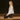 woman meditating sitting on restorative cork block and the Rituil™ cork yoga mat