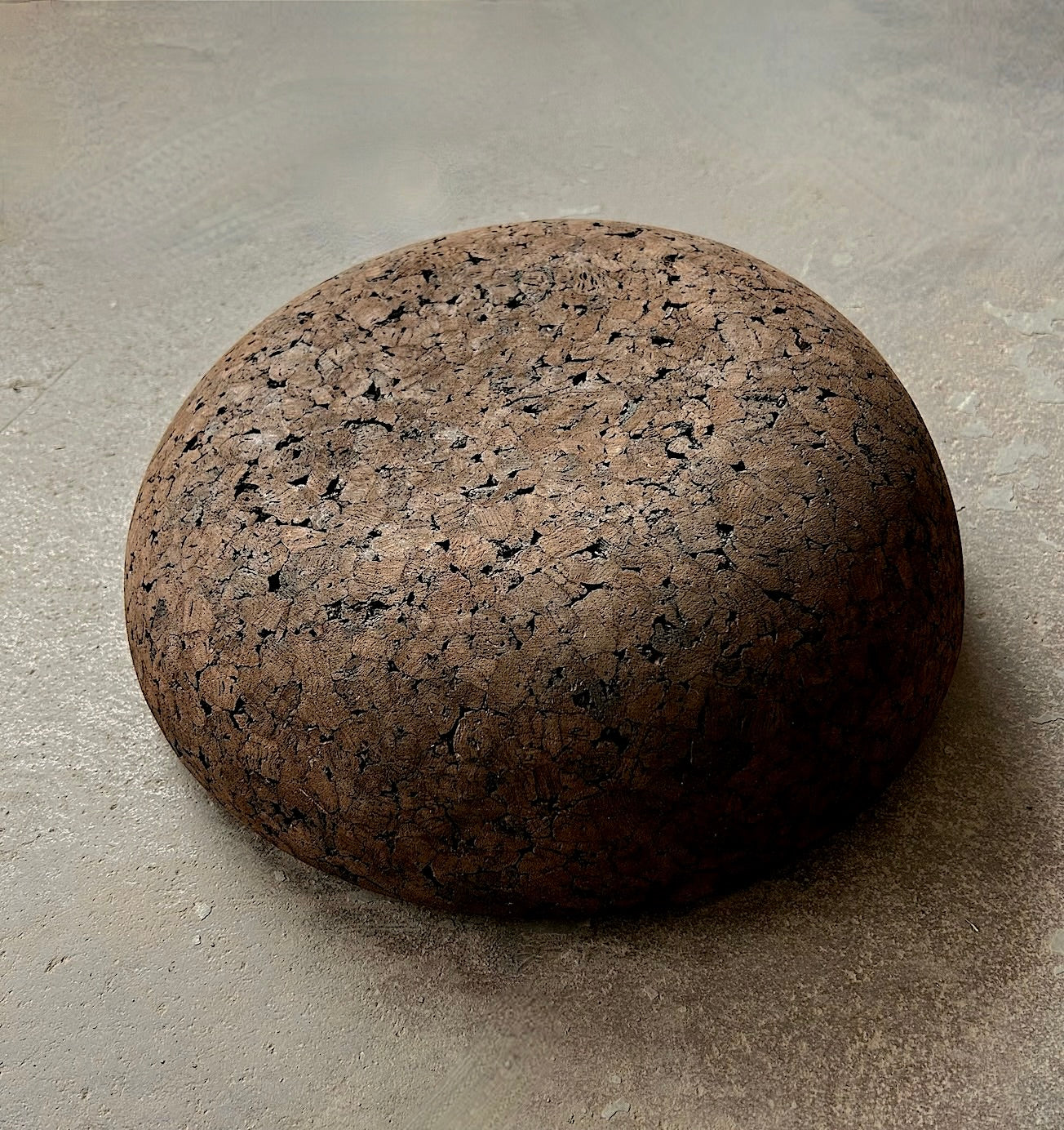 Rituil cork meditation seat on top of concrete floor
