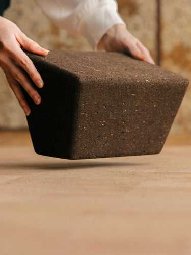 Rituil cork restorative yoga block placed on cork yoga mat