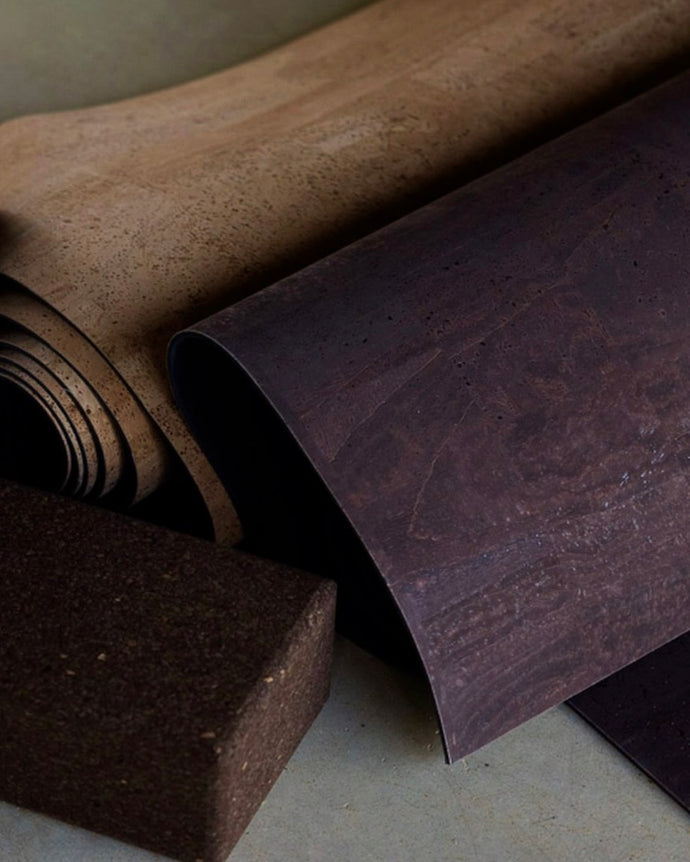 rituil cork leather yoga mat and blocks on concrete floor