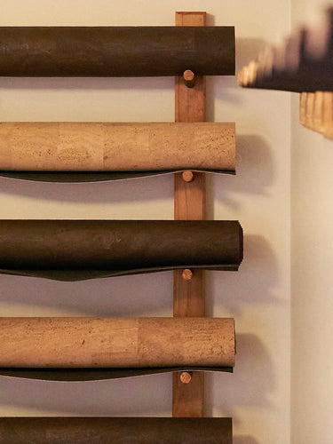 rituil natural cork leather yoga mats on wall