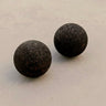set of 2 cork massage balls on concrete floor