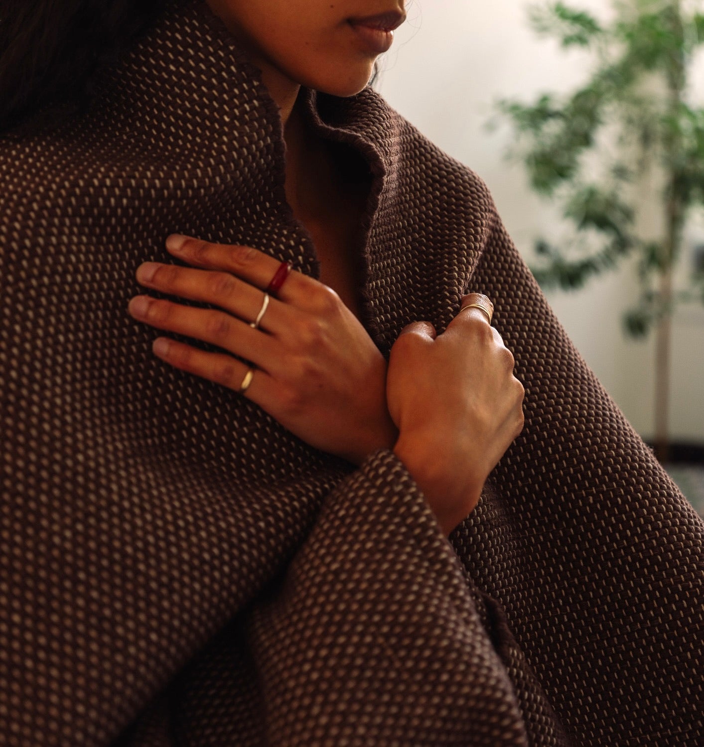 woman wrapped in rituil cotton yoga rug and blanket