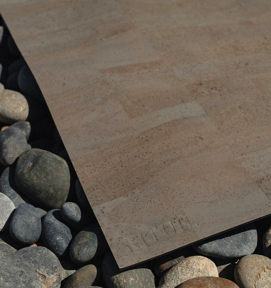 Rituil sustainable natural grey cork leather yoga mats featuring a non-slip, non-toxic, pvc free, on rocks