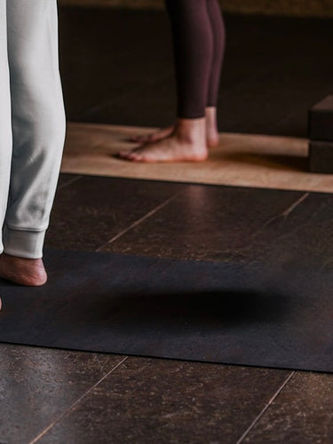 two woman standing on rituil cork non slip non toxic cork mats in a studio