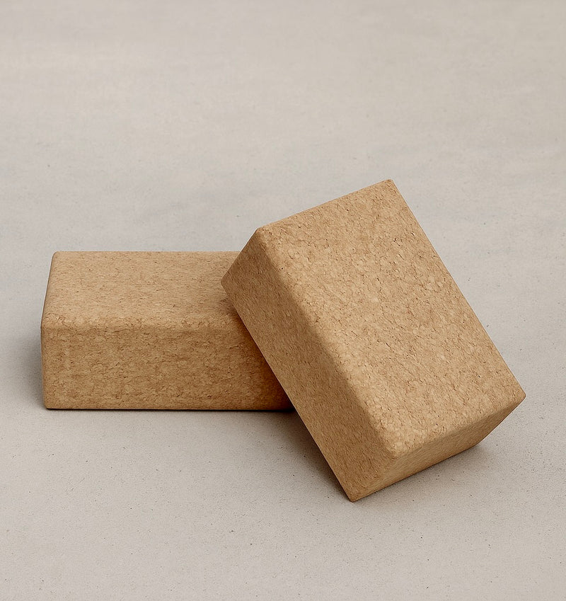 Two natural cork yoga blocks on a light gray background #color_sand