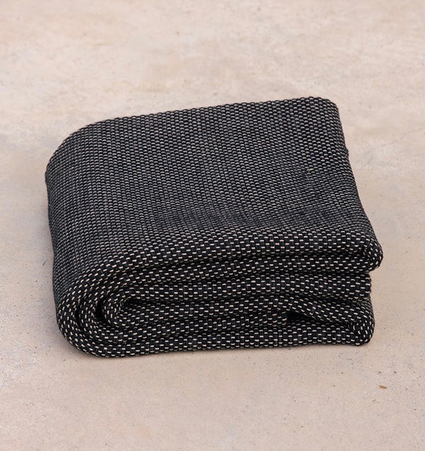 folded Rituil recycled cotton yoga rug in ash or black color #color_ash