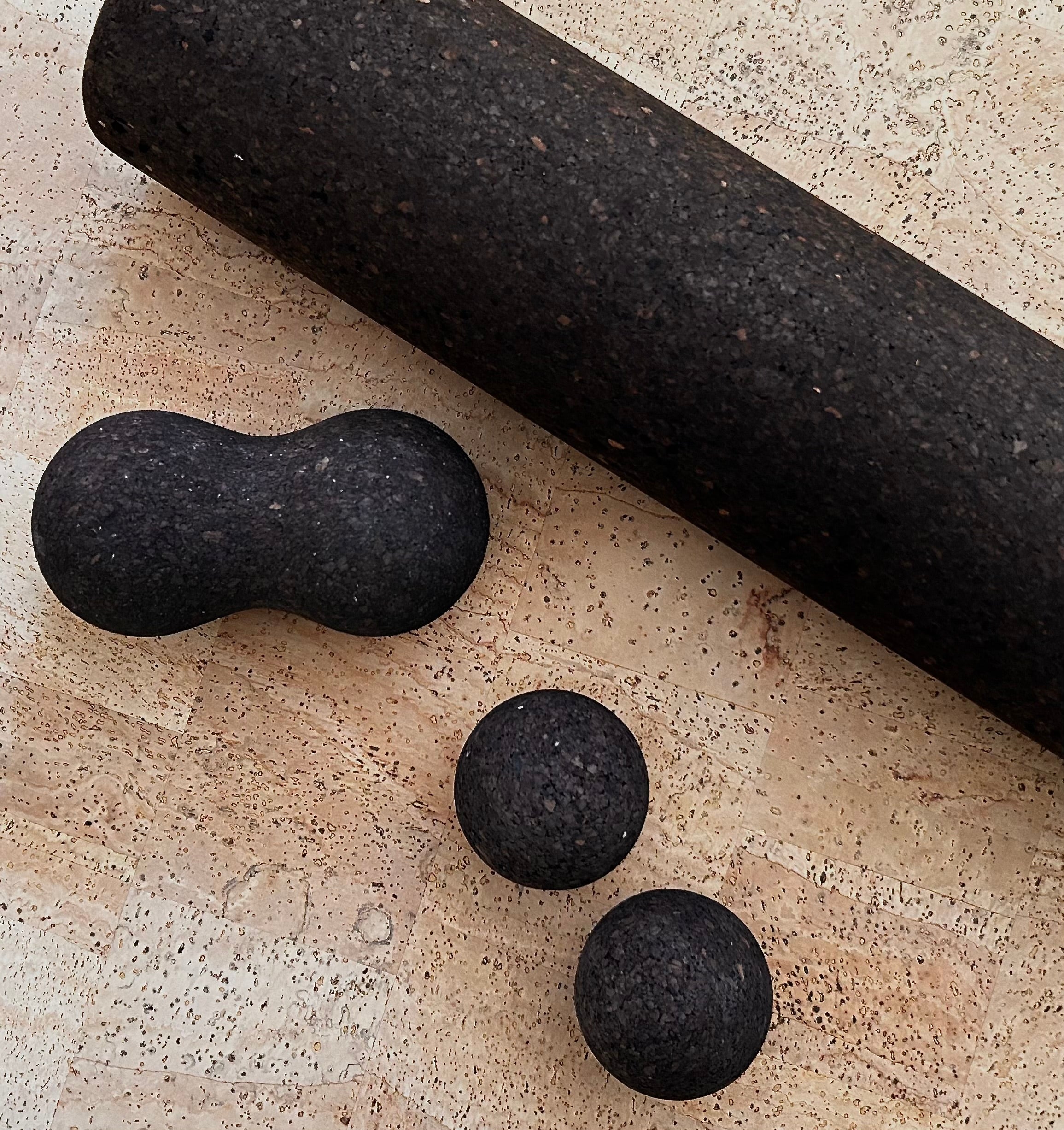 the Rituil Recover Kit with cork roller peanut and spheres on cork yoga mat