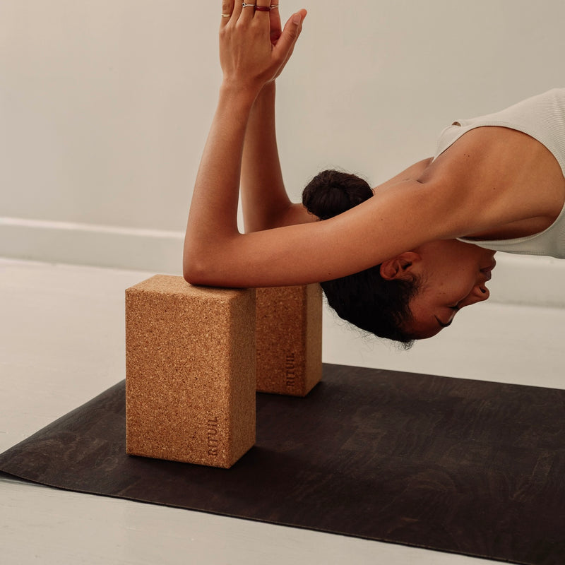 woman with rituil cork yoga mat and cork yogha blocks 